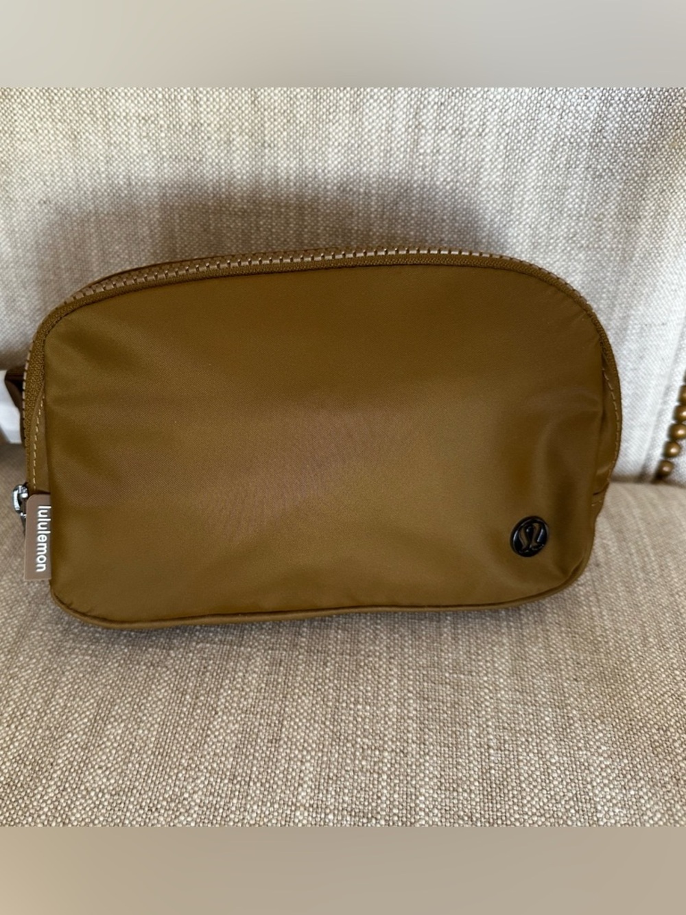 lululemon athletica small pouch in tan brown. Unused. Back zip pocket